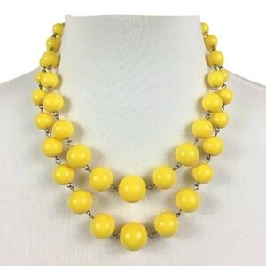 Yellow double-strand beaded statement necklace.